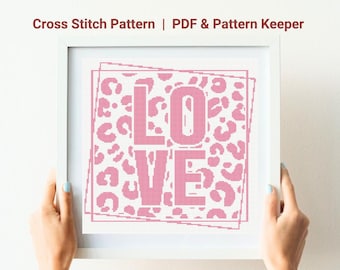 May include: Cross stitch pattern for the word "LOVE" in pink lettering on a white background with a pink leopard print pattern.
