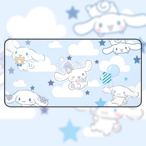 May include: A blue and white mousepad with a cartoon dog design. The dog is wearing a hat and bow tie and is surrounded by clouds and stars.