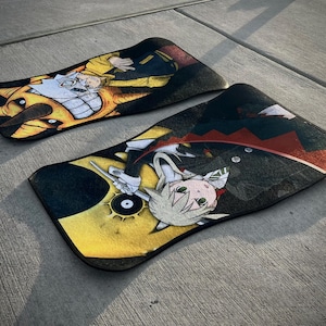 Custom Soul Eater car mats featuring Maka Albarn and her scythe partner, Soul. Inspired by the anime's action-packed adventures, these durable mats bring Death Weapon Meister Academy style to your ride. Perfect for fans of Maka, Soul