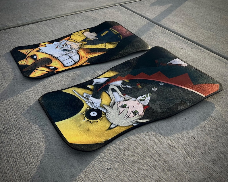 Custom Soul Eater car mats featuring Maka Albarn and her scythe partner, Soul. Inspired by the anime's action-packed adventures, these durable mats bring Death Weapon Meister Academy style to your ride. Perfect for fans of Maka, Soul