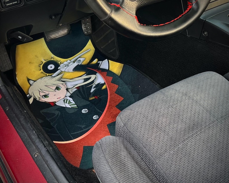 Custom Soul Eater car mats featuring Maka Albarn and her scythe partner, Soul. Inspired by the anime's action-packed adventures, these durable mats bring Death Weapon Meister Academy style to your ride. Perfect for fans of Maka, Soul