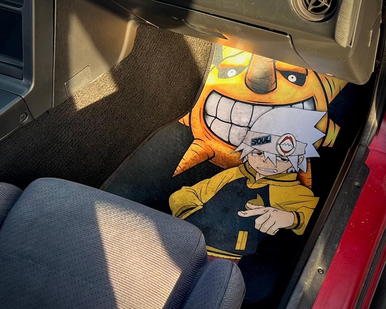 Custom Soul Eater car mats featuring Maka Albarn and her scythe partner, Soul. Inspired by the anime's action-packed adventures, these durable mats bring Death Weapon Meister Academy style to your ride. Perfect for fans of Maka, Soul