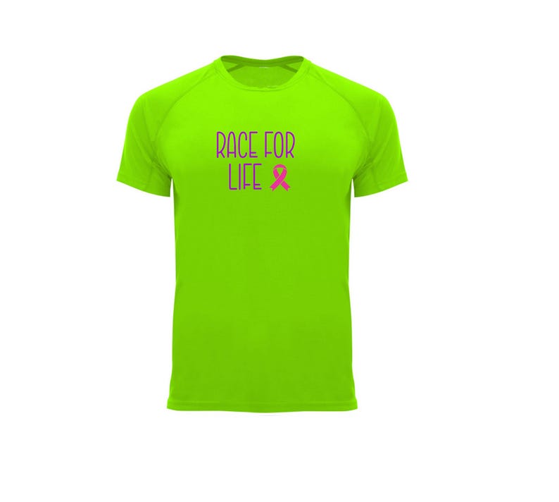 May include: A neon green short-sleeved t-shirt with the text "RACE FOR LIFE" in purple, and a pink ribbon graphic. The shirt is made of a lightweight material, suitable for athletic activities or casual wear.