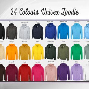 May include: A display of 24 different color unisex hoodies. The hoodies are arranged in four rows of six, with each row representing a different color family. The colors include black, charcoal, heather grey, navy, royal blue, sapphire blue, turquoise, light blue, cappuccino, orange, mustard, yellow, bottle green, olive, kelly green, dusty green, brown, burgundy, red, hot pink, rose gold, purple, lilac, and white.