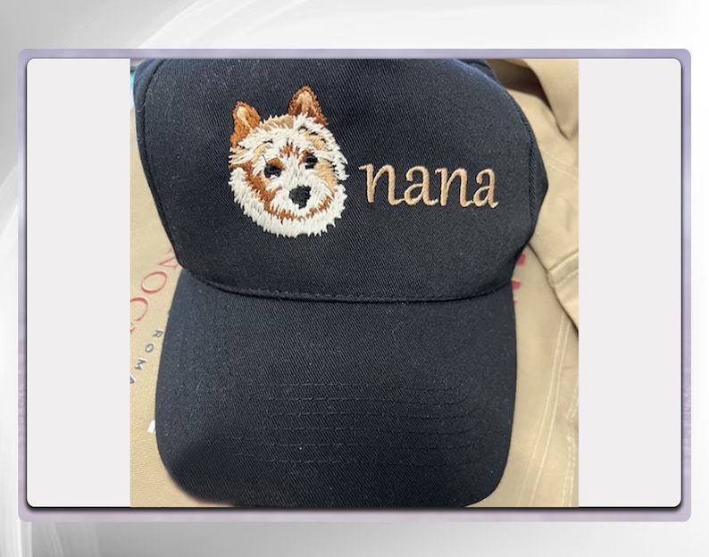 May include: Black baseball cap with an embroidered image of a dog and the word "nana" in brown thread.