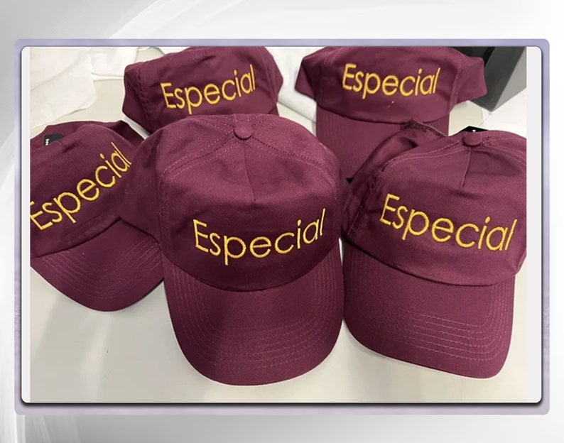 May include: Five maroon baseball caps with the word "Especial" embroidered in yellow on the front.