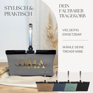 May include: A grey and black foldable shopping basket with a silver handle. The basket has the word "OMA" in gold lettering with the name "simone" below it. The image also shows a selection of different coloured baskets.