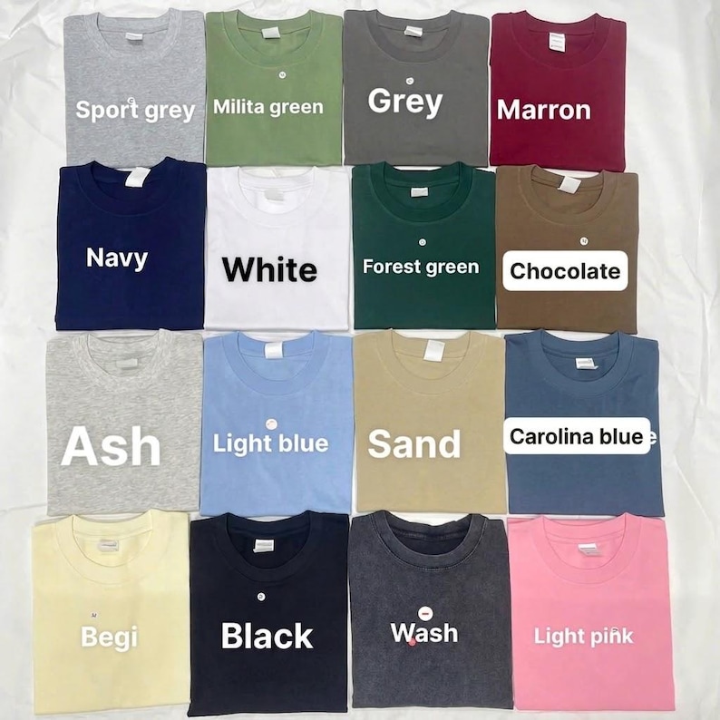 Pode incluir: Uma cole&ccedil;&atilde;o de dezasseis t-shirts de manga curta com gola redonda dispostas numa grelha, apresentando v&aacute;rias cores s&oacute;lidas, incluindo sport grey, military green, grey, maroon, navy, white, forest green, chocolate, ash, light blue, sand, Carolina blue, beige, black, wash e light pink.