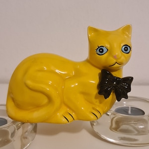 A porcelane cat figurine.