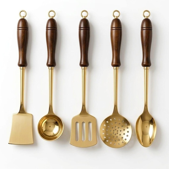 Hand-forged solid brass kitchen utensils with turned wooden handles — the kind of heirloom-quality, visually stunning set that instantly becomes the conversation piece of any kitchen.