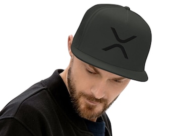 May include: A black trucker hat with a black X-shaped logo on the front. The hat is worn by a person with a beard.