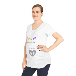 May include: White maternity t-shirt with a rainbow star garland and the text "Whoever You Are... I Love You!" with a gray footprint heart.