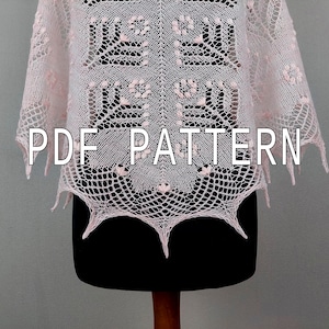 Może przedstawiać: Różowy szal wykonany na szydełku z geometrycznym wzorem. Szal jest prezentowany na czarnym manekinie. Na szalu nadrukowany jest tekst "PDF PATTERN".