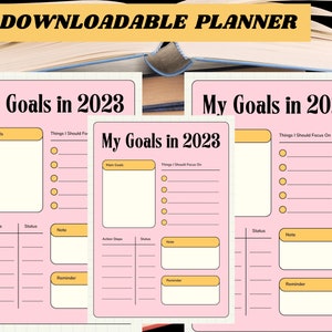 Può includere: Pianificatore stampabile con accenti rosa e gialli. Il pianificatore è intitolato "I miei obiettivi nel 2023" e include sezioni per gli obiettivi principali, le cose su cui concentrarsi, i passaggi dell'azione, lo stato, le note e i promemoria.