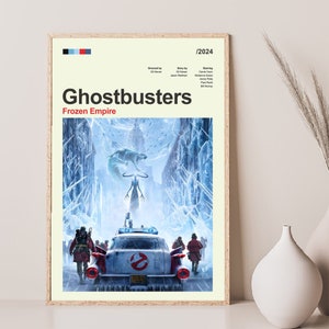 May include: A movie poster for the film "Ghostbusters: Frozen Empire" featuring a vintage car driving through a snowy city street. The car is covered in ice and snow, and there is a large, ghostly figure in the background.