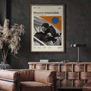 May include: A minimalist poster for the movie "Mission: Impossible - Ghost Protocol". The poster features a black and white image of Tom Cruise hanging from a building, with a blue circle and orange rectangle in the background. The text "Mission: Impossible - Ghost Protocol" is in a bold, sans-serif font. The year "2011" is in the bottom right corner.