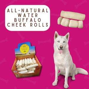 May include: A white dog sits on a pink background. The dog is looking at the camera and has its tongue sticking out. The dog is surrounded by white chew toys. The text "All-Natural Water Buffalo Cheek Rolls" is in a white box on the left side of the image.