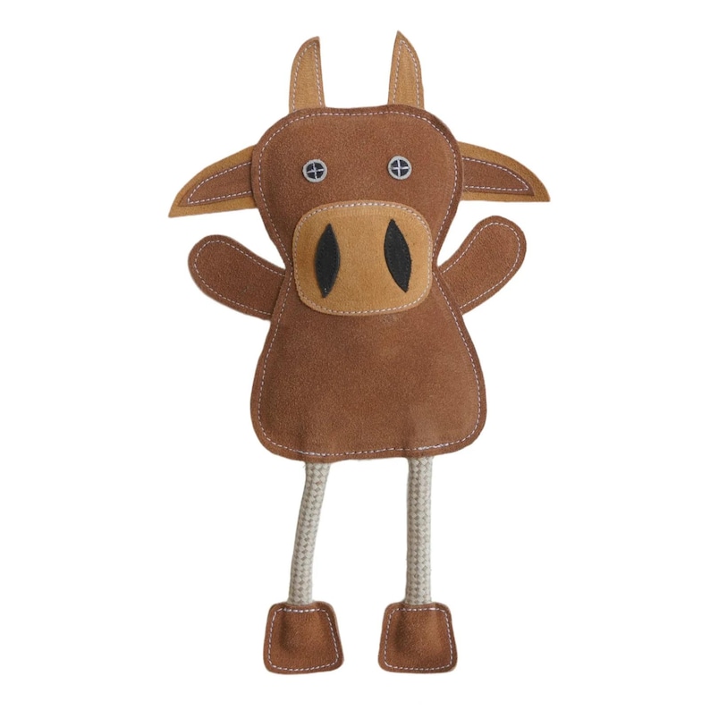 May include: Brown plush dog toy shaped like a cow with long rope legs. The toy has black eyes and a brown nose.