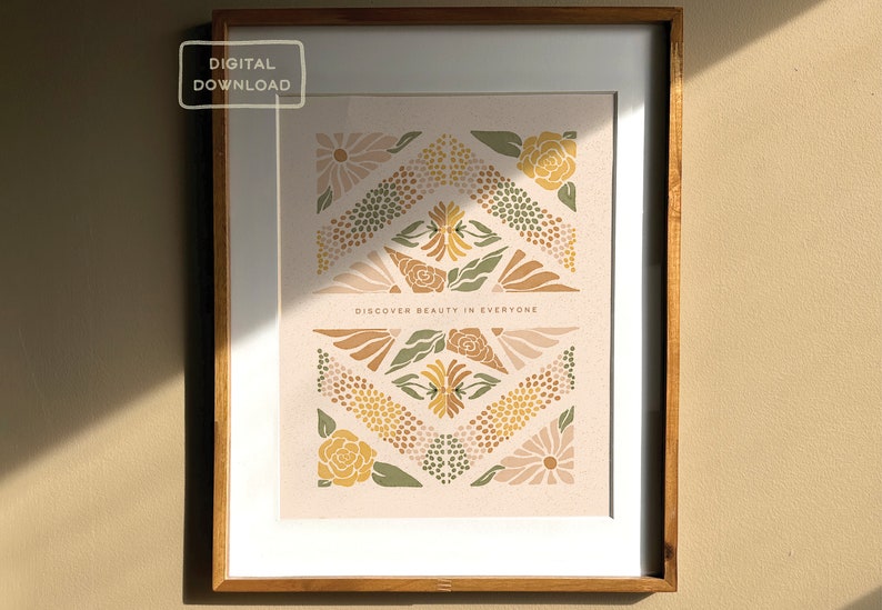 May include: A digital download of a printable art print featuring a geometric pattern of flowers in shades of brown, yellow, and green. The text "Discover beauty in everyone" is centered at the bottom of the print.