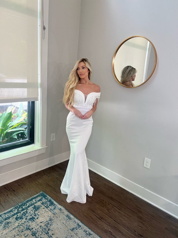 beaded wedding reception dress The perfect reception dress adorned with crystals, stones and pearls with  matching hand beaded gloves. #ryanpatros #photographer @jackhenryphoto