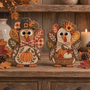 May include: Two decorative wooden turkey figurines featuring autumn-themed designs. The left turkey wears a hat and bowtie, while the right turkey holds a basket of pumpkins. Both have colorful fan-shaped tail feathers with leaf and plaid patterns.