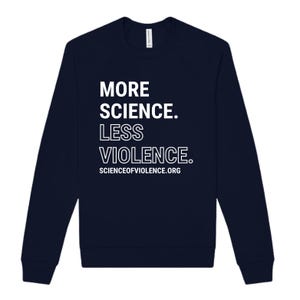 May include: Navy blue sweatshirt with white text that reads "MORE SCIENCE. LESS VIOLENCE." The website "SCIENCEOFVIOLENCE.ORG" is printed below the text. The sweatshirt has long sleeves and a crew neck.