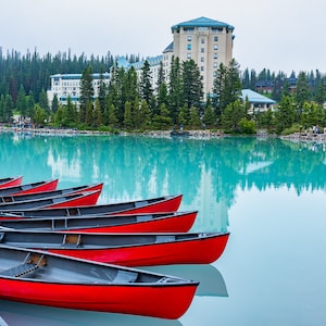 Red canoes docked at Lake Louise with Fairmont Chateau Hotel in the back | Travel photography | Prints, Canvas Photo Print, Framed, Metal