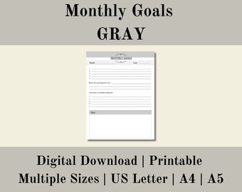 May include: Printable monthly goals planner in gray with a simple design. The planner includes sections for listing goals, reasons for goals, and steps to achieve goals. The planner is available in multiple sizes, including US Letter, A4, and A5.