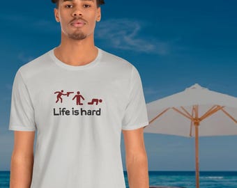 Life Is Hard Parody light T-Shirt – Funny Shooter Graphic Tee – Soft Cotton Spoof Shirt – Dark Humor Gift for Realists
