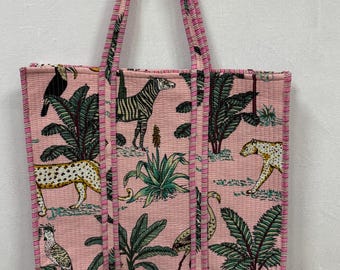 Bolsa acolchoada com estampa de blocos de mão: design artesanal de animais da selva