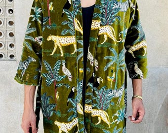 May include: A green velvet robe with a jungle print featuring leopards, zebras, toucans, and palm trees.
