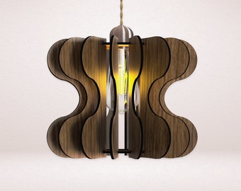 May include: A wooden pendant light fixture with a geometric design. The light is made of multiple pieces of wood that are shaped into a wavy pattern. The light is lit and casts a warm glow.