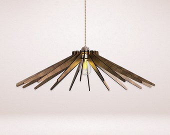May include: A wooden pendant light fixture with a starburst design. The light fixture is made of multiple wooden slats that radiate outwards from a central point. The light fixture is suspended from a cord and has a single light bulb.