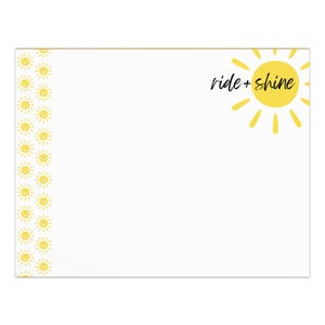 May include: White stationery with a yellow sunburst design and the words "ride + shine" in black script. A border of small yellow suns lines the left side of the stationery.