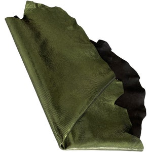 May include: A piece of green snakeskin leather with a textured surface. The leather is folded in half and the edges are visible.