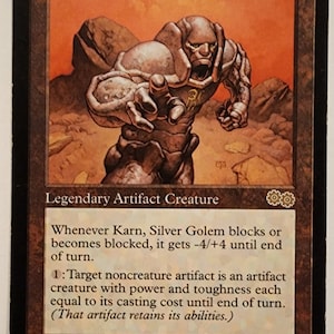 May include: A Magic: The Gathering card featuring a silver golem creature named Karn, Silver Golem. The card has a power and toughness of 4/4 and is a legendary artifact creature. The card text reads: "Whenever Karn, Silver Golem blocks or becomes blocked, it gets -4/+4 until end of turn. 1: Target noncreature artifact is an artifact creature with power and toughness each equal to its casting cost until end of turn. (That artifact retains its abilities.)"