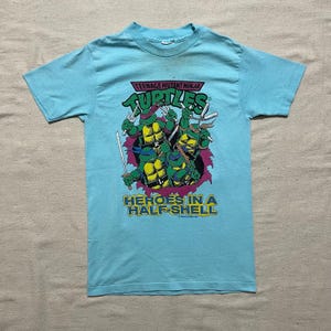 Vintage jaren 90 kinderen/jeugd Teenage Mutant Ninja Turtles Heroes in a Half Shell Cartoon grafisch T-shirt blauw maat jeugd medium/groot