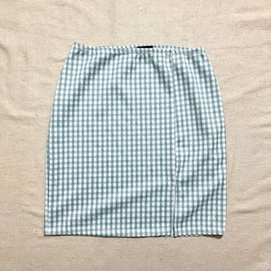 May include: A light blue and white gingham mini skirt with a side slit.
