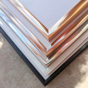 a close up of a stack of metal sheets