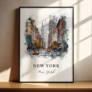 May include: Framed watercolour print of a New York City street scene, featuring yellow taxis, tall buildings, and the Empire State Building. The print has the words "NEW YORK" and "New York" in a script font.