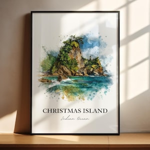 Pode incluir: Uma impressão em aquarela emoldurada da Ilha Christmas no Oceano Índico. A obra de arte retrata uma ilha rochosa com vegetação verde exuberante, água turquesa e um céu azul. As palavras "Christmas Island" e "Indian Ocean" são impressas em preto na parte inferior.