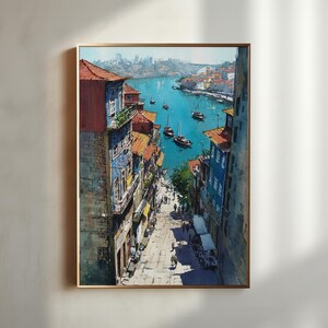 Puede incluir: Pintura a la acuarela de un paisaje urbano europeo con edificios que bordean una calle que conduce a un r&iacute;o. Los edificios tienen tejados de tejas rojas y fachadas coloridas. Hay barcos en el agua. La obra de arte est&aacute; enmarcada en un marco dorado.