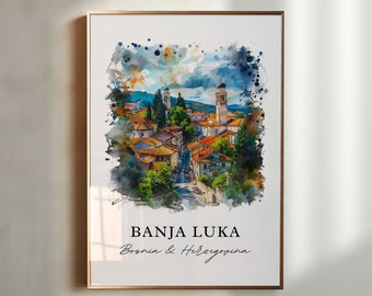 Könnte beinhalten: Ein Aquarellbild von Banja Luka, Bosnien und Herzegowina. Das Bild zeigt eine Stadtlandschaft mit Gebäuden, Straßen und Bäumen. Das Bild ist in einem goldenen Rahmen gerahmt.