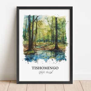 May include: Watercolor painting of a forest scene with a stream running through it. The painting is framed in black and has the text "Tishomingo State Park" at the bottom.