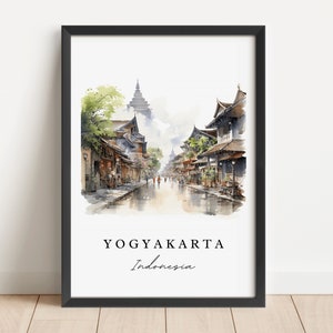 May include: A watercolour painting of a street scene in Yogyakarta, Indonesia. The street is lined with traditional buildings and there are people walking on the street. The painting is framed in a black frame.