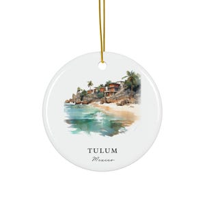 May include: A watercolour-style illustration of a beach scene in Tulum, Mexico. The image features a sandy beach, turquoise water, palm trees, and a few buildings on a cliff overlooking the ocean. The text "Tulum, Mexico" is printed below the image.