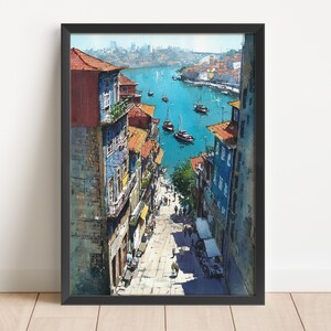 Puede incluir: Una pintura de acuarela enmarcada representa un paisaje urbano europeo con edificios que bordean una calle que conduce a un r&iacute;o. Los edificios tienen tejados de tejas rojas y fachadas coloridas. Hay barcos en el agua azul. La obra de arte est&aacute; en un marco negro.