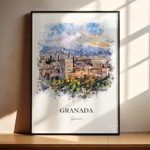 May include: A watercolor painting of the Alhambra palace in Granada, Spain. The painting is in a black frame and has a white background. The text "GRANADA" and "Spain" is written below the painting.