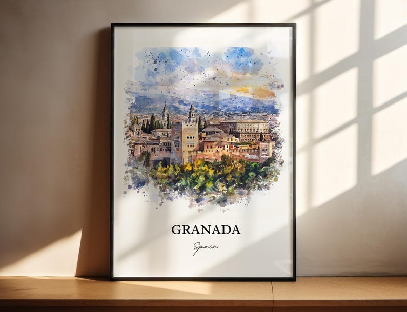 May include: A watercolor painting of the Alhambra palace in Granada, Spain. The painting is in a black frame and has a white background. The text "GRANADA" and "Spain" is written below the painting.