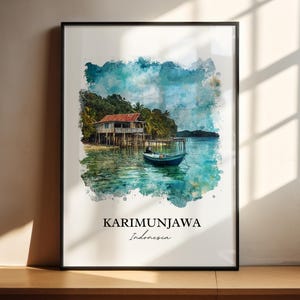 May include: Watercolor print of Karimunjawa, Indonesia. The artwork depicts a stilt house with a red roof, a small boat, and lush greenery. The text "KARIMUNJAWA Indonesia" is printed at the bottom of the image, framed in a black border.